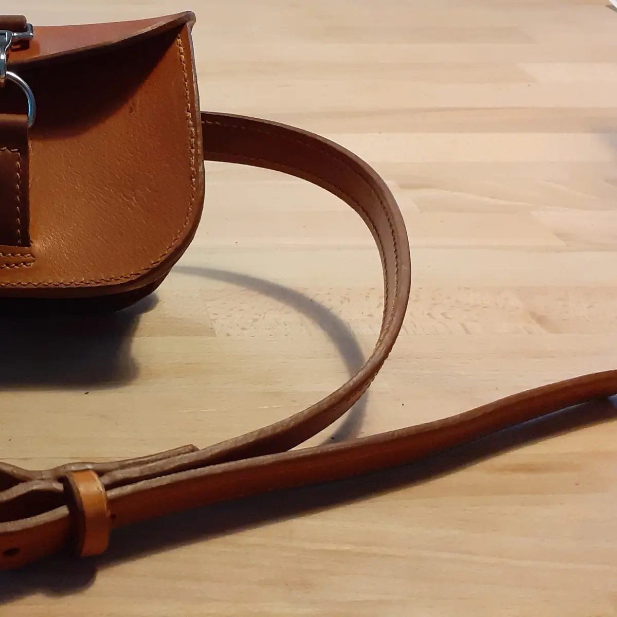 Made from the same leather as the tack.