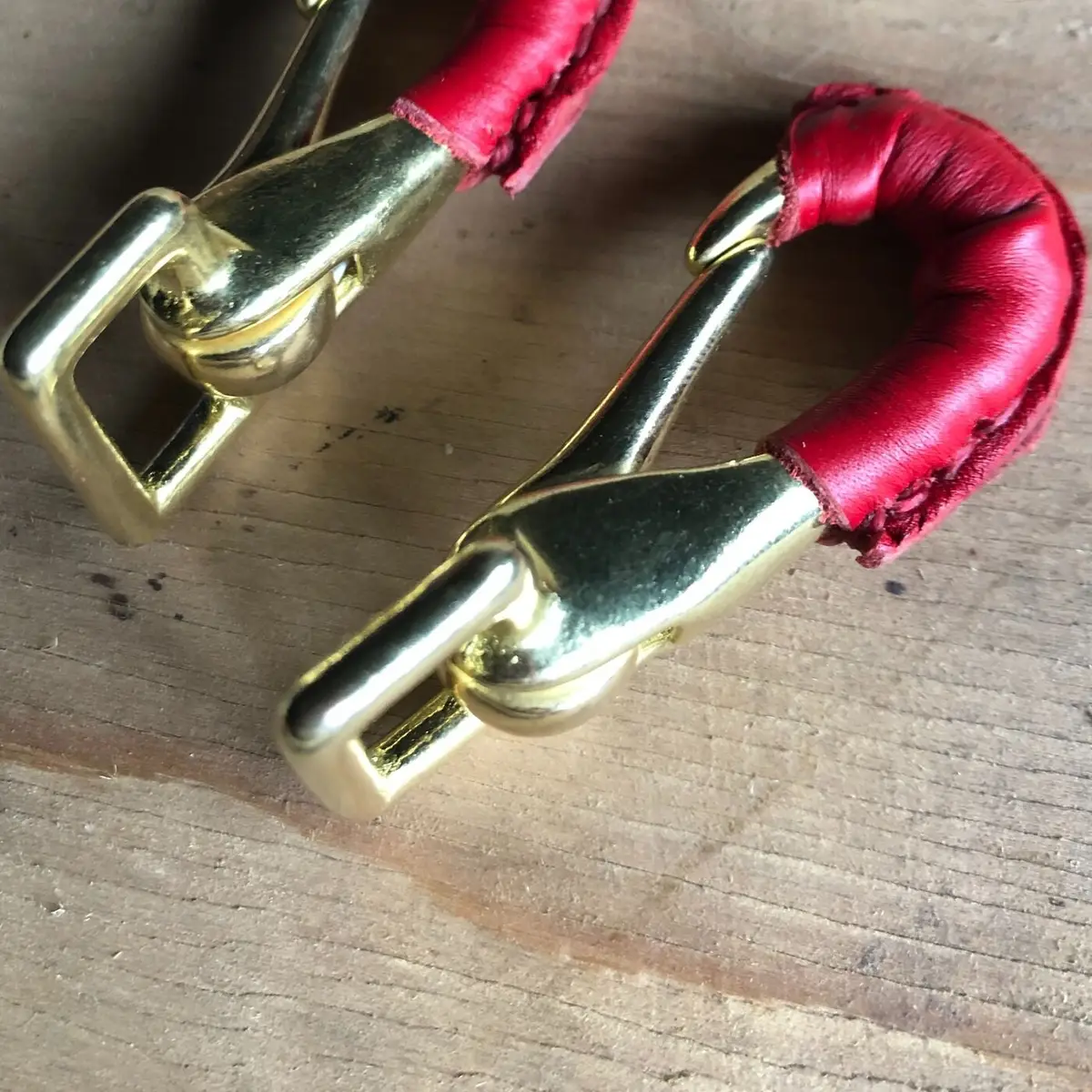 Pair of leather-sheathed bridle carabiners